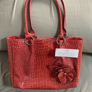 Coral color, faux, leather purse with flower decal